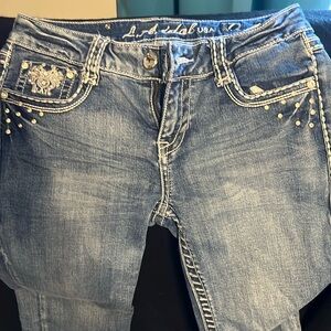 Cropped Jeans with bling on pockets . Note the last pic. L A is loose